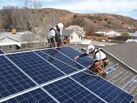 Photo 1. Installers on roof credit: Habitat for Humanity, Silt, CO Credit: Sunsense Solar