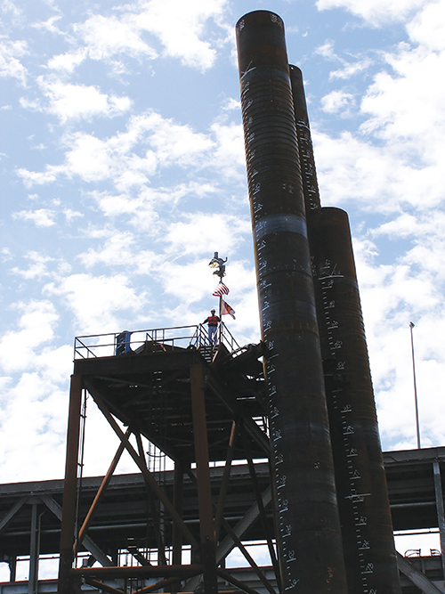 Photo 5. Pile driving template (SFO Bay Bridge). Temporary power, for hydraulics, was needed also for setting the appropriate angle to drive the 365-ton bridge piles to 300+ feet below the water’s surface. The challenge being that loss of power could severely impact the project schedule. 