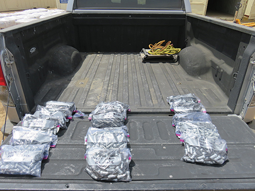 Photo 9. Special inspector takes individual samples of each lot which will be sent to an approved test lab for verification and testing. 