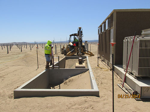 Photo 2B. Because the contractor did not plan to control the sand and dust, they spent several weeks remediating the vaults in order to install the medium voltage cables. Upon remediation, the 1.5 MW PV shelter (to the immediate right) was installed on top of this vault. But that wasn’t possible on the day of this photo.