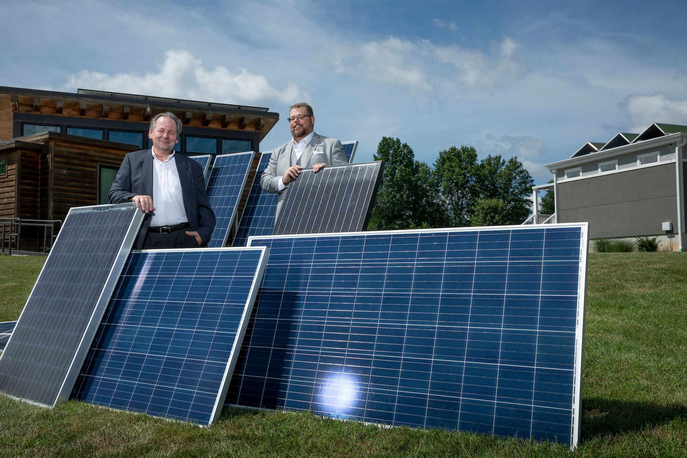 Dr. Stuart Baur (left) and Thomas Yarbrough with discarded solar panels at Missouri S&T's EcoVillage. Photo by Tom Wagner, Missouri S&T.