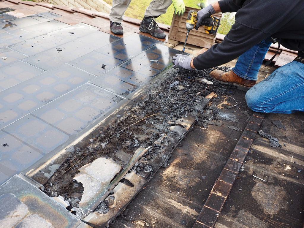 Photo 2. Roof sheathing damaged under PV module that was involved in the fire.