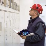 Inspector holding a copy of the Canadian Electrical Code