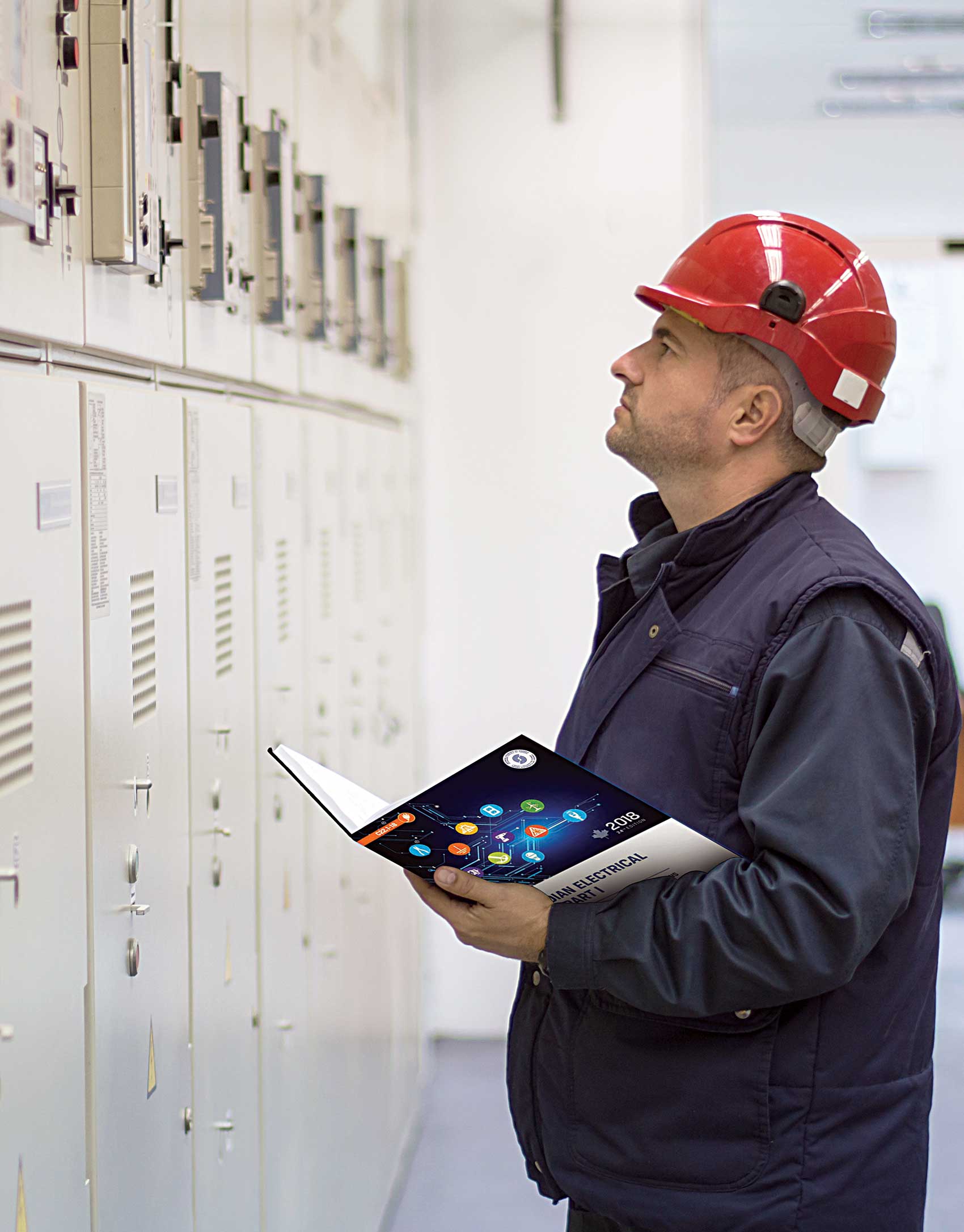 Inspector holding a copy of the Canadian Electrical Code