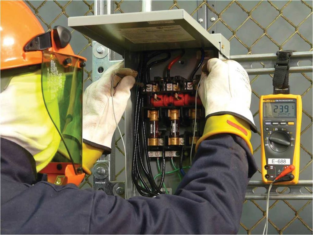 Photo 12. Verifying the test instrument is operating correctly on a known voltage source.