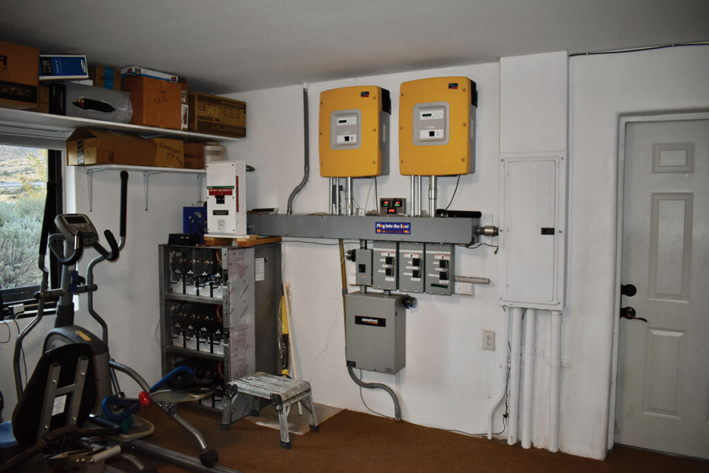 Photo 3. Multimode PV/Battey system with power control system (PCS) functions controlling battery charging/discharging, generator operation, and grid interface internal to the multimode inverters.  Courtesy of John Wiles.