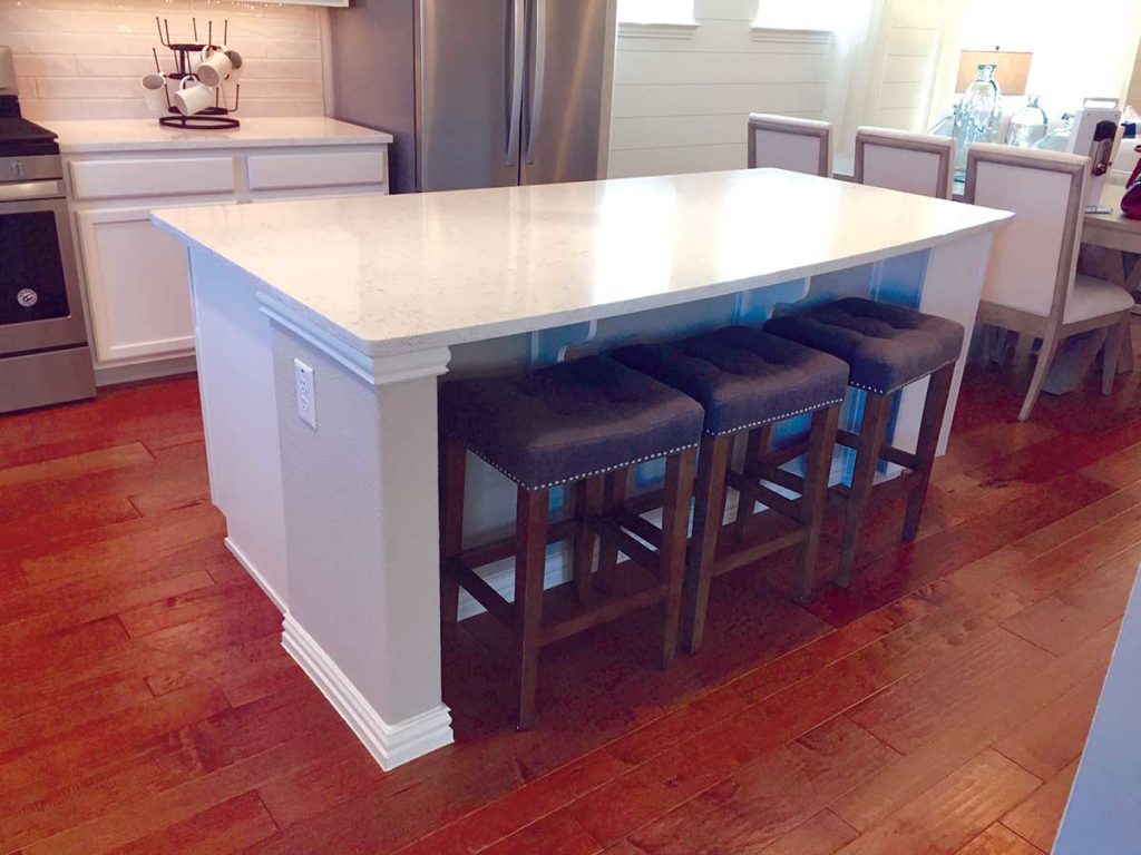 Photo 1. Rectangular kitchen island with seating.