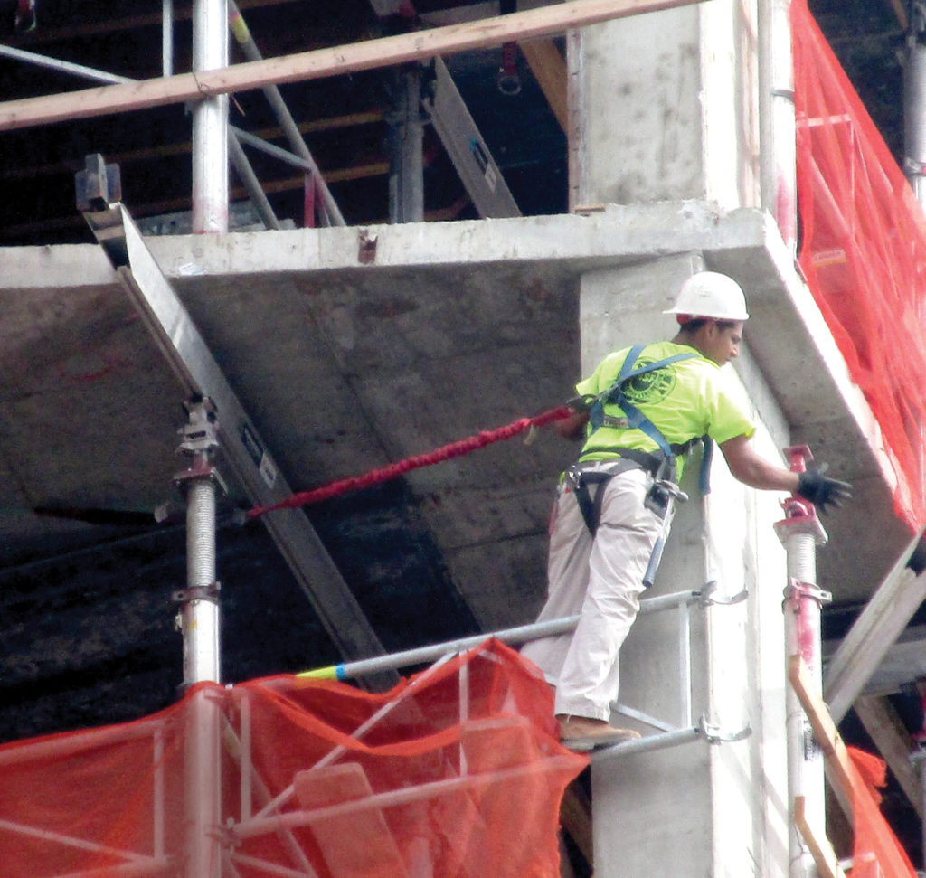 Photo 2. A new law now requires NYC construction workers to prove they’re safety conscious by earning a safety training card through 40 hours of classes.