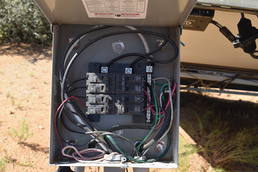 Photo 2. Main-lug-only panel with four, 2-pole breaker positions available. This product is useable as service entrance equipment only when one of the breakers is connected as a main breaker. The photo shows panel used as ac combiner for string inverter and ac PV modules. Photo by John Wiles.